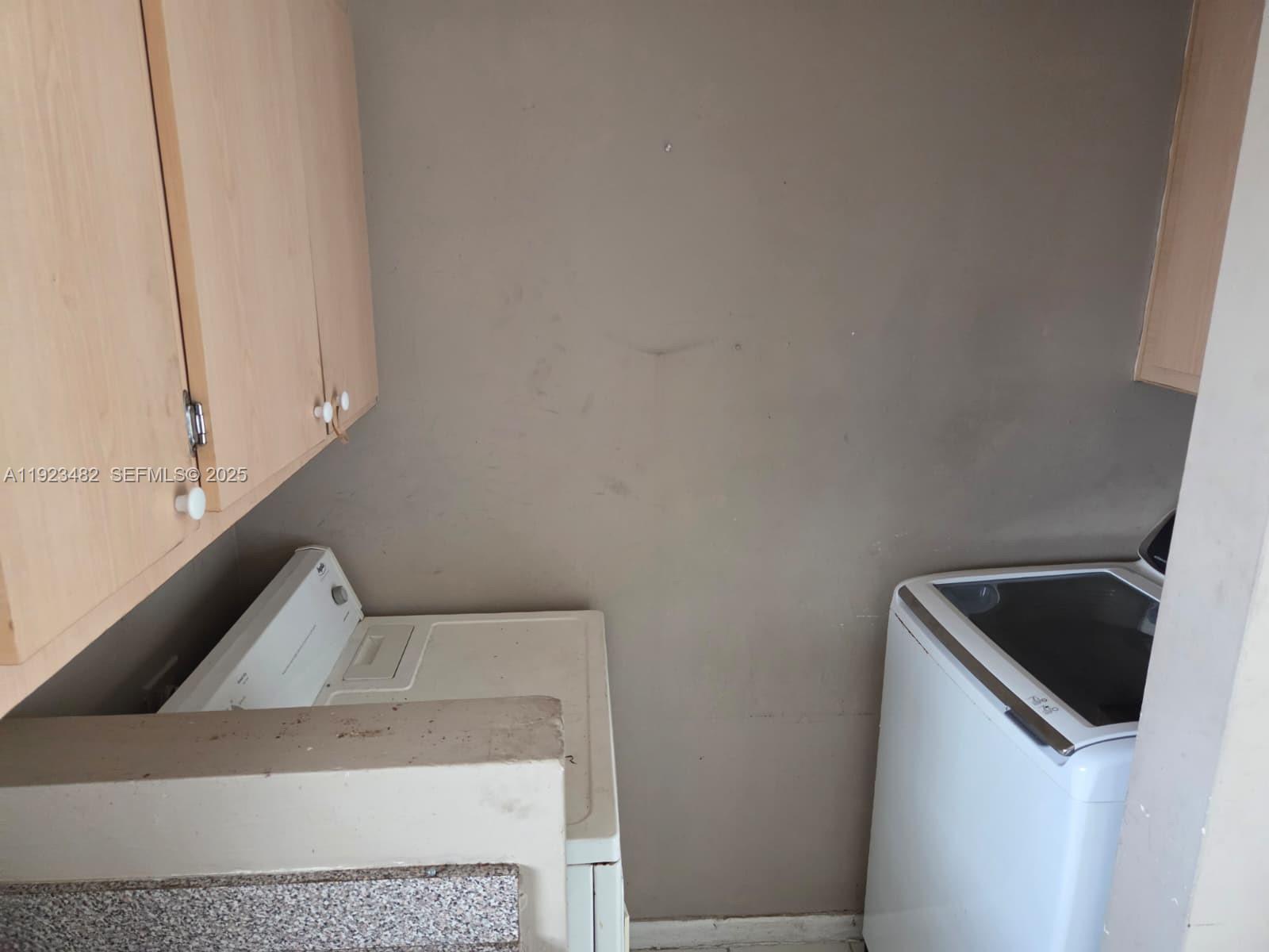 12412 Southwest 112th Terrace Miami, FL 33186 - Photo 16 of 18 a utility room with dryer and washer