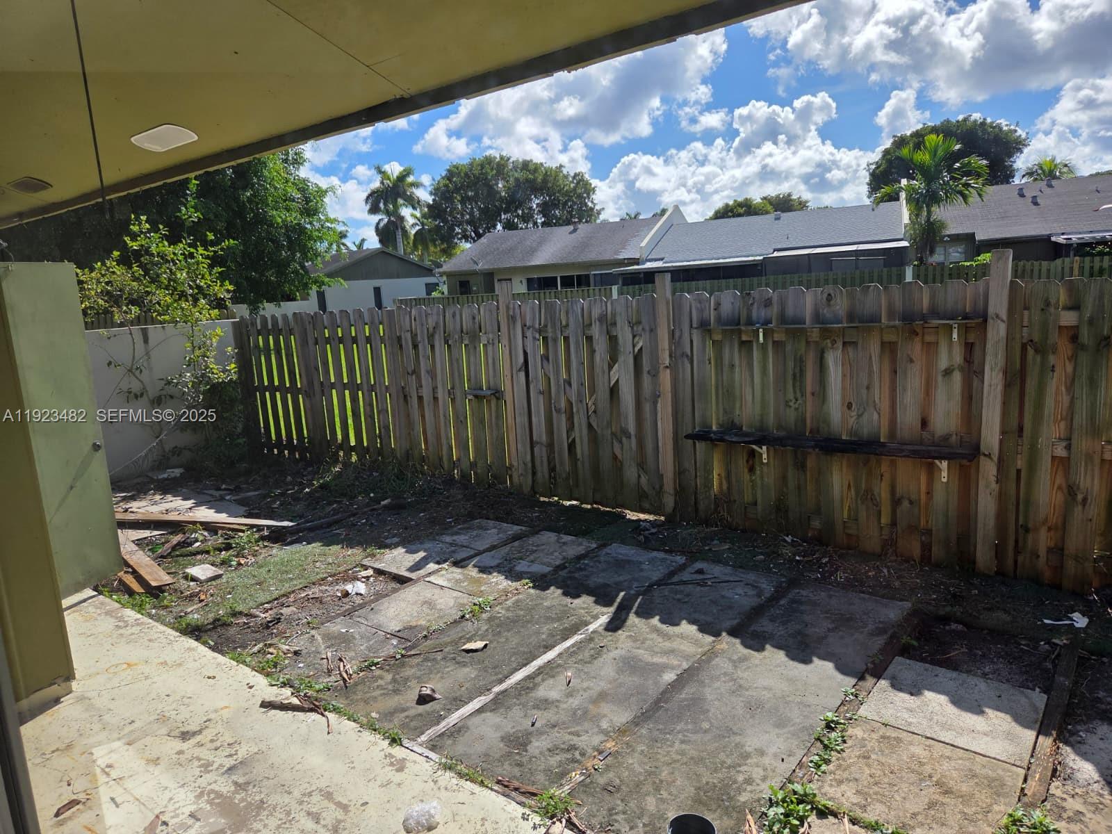 12412 Southwest 112th Terrace Miami, FL 33186 - Photo 17 of 18 a view of a backyard with wooden fence
