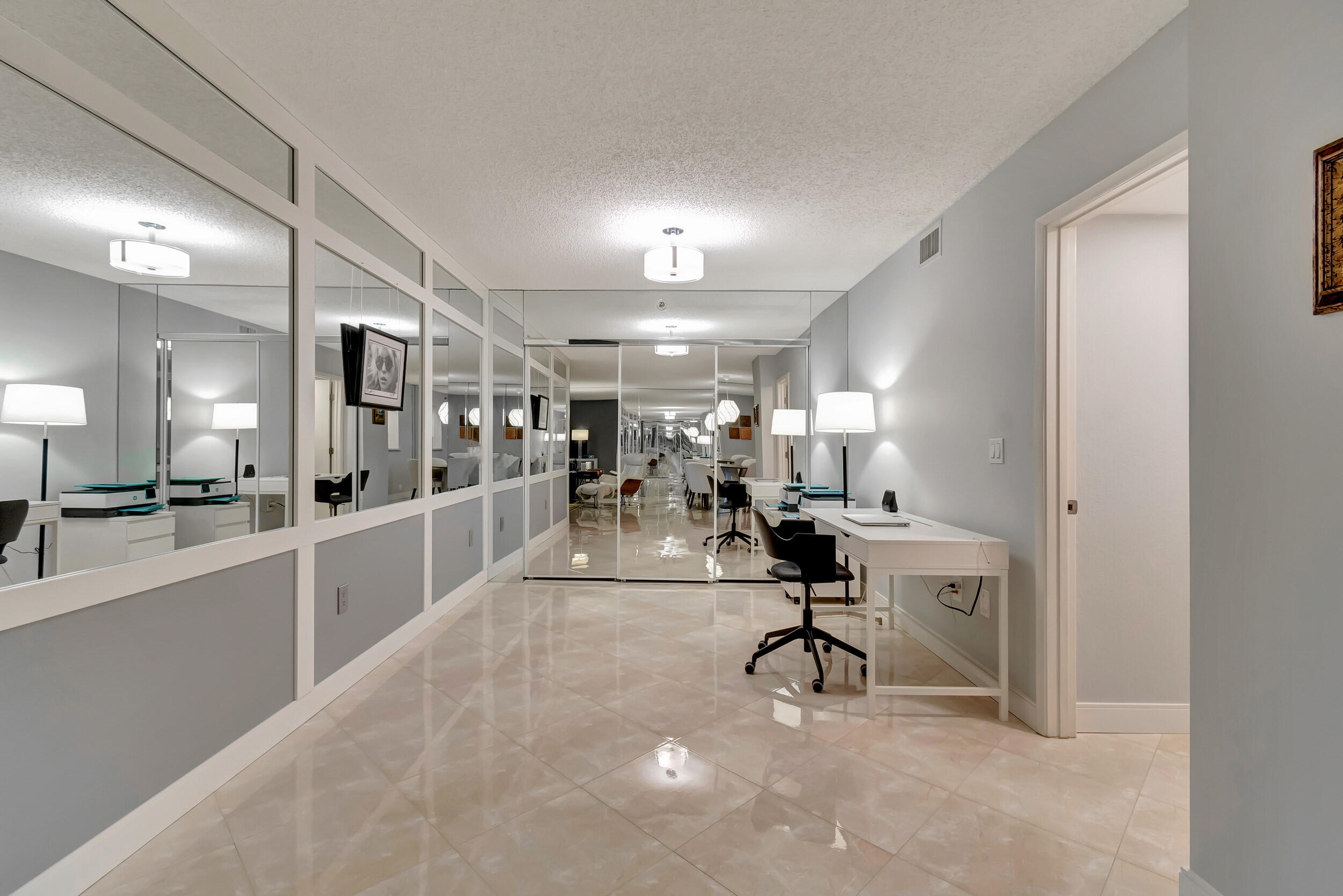 6269 Pointe Regal Circle, Unit 102 Delray Beach, FL 33484 - Photo 18 of 51 a view of a room with gym equipment and a large window