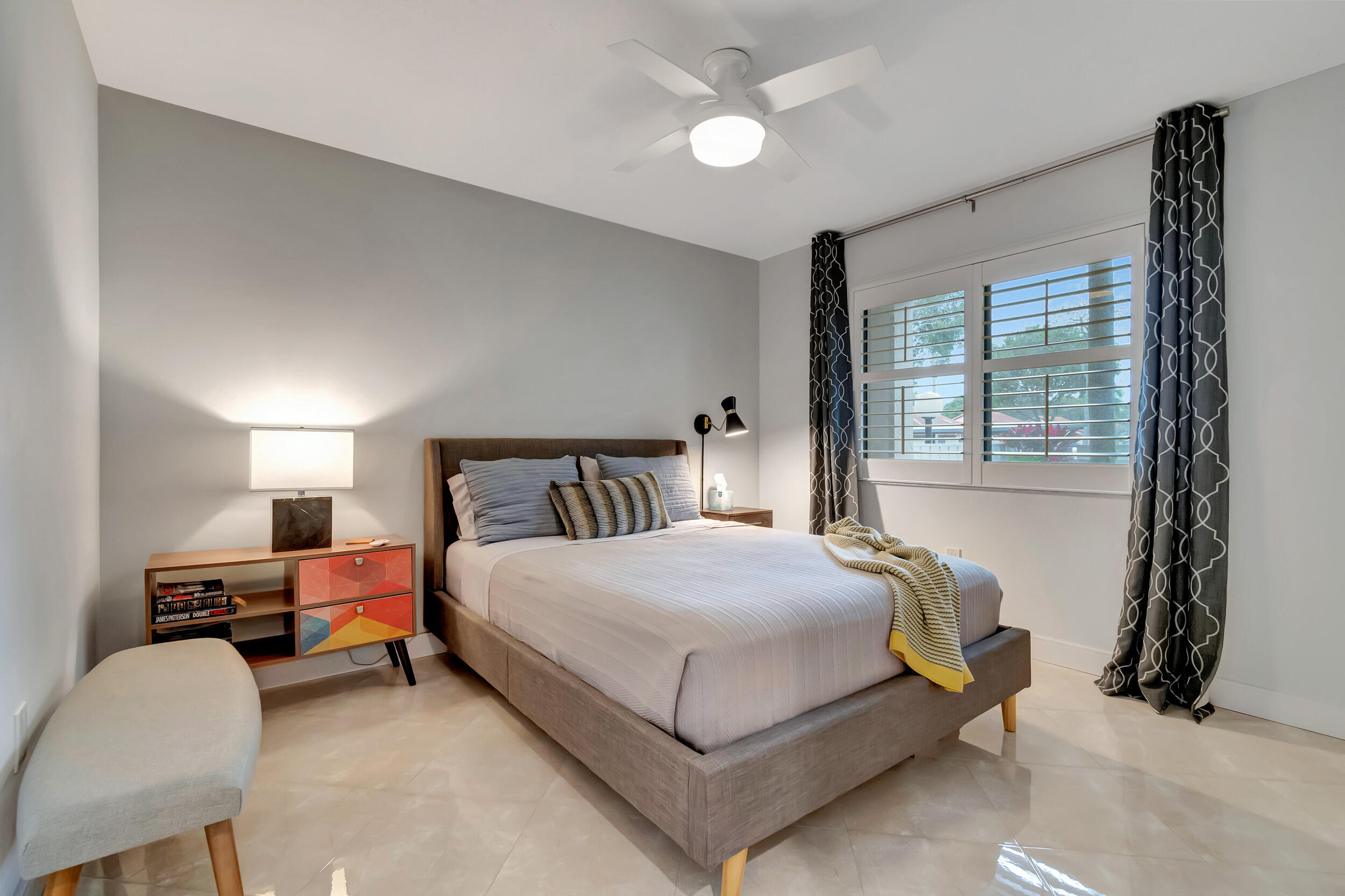 6269 Pointe Regal Circle, Unit 102 Delray Beach, FL 33484 - Photo 26 of 51 a bedroom with a bed and window