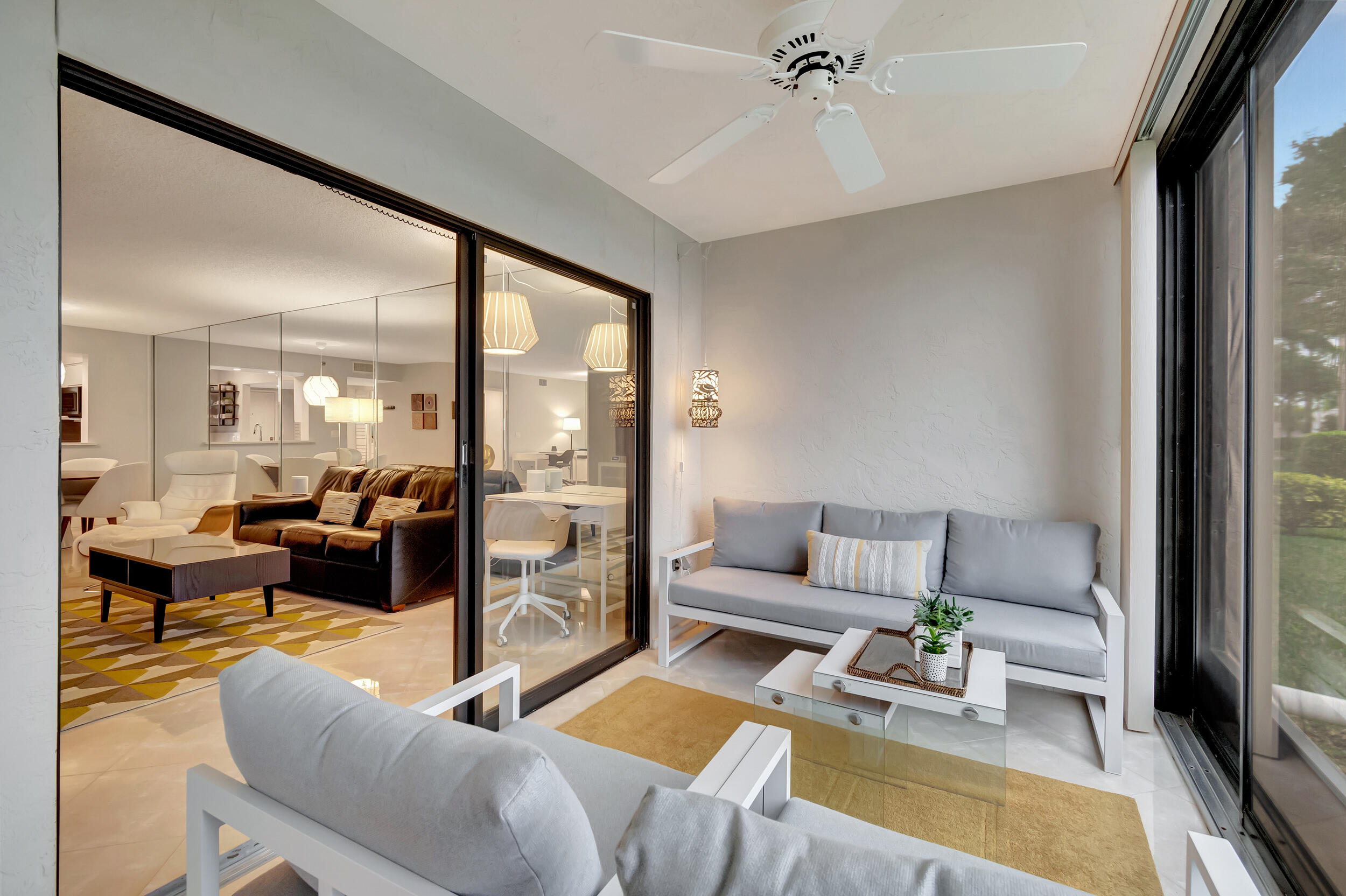 6269 Pointe Regal Circle, Unit 102 Delray Beach, FL 33484 - Photo 33 of 51 a living room with furniture and a large window