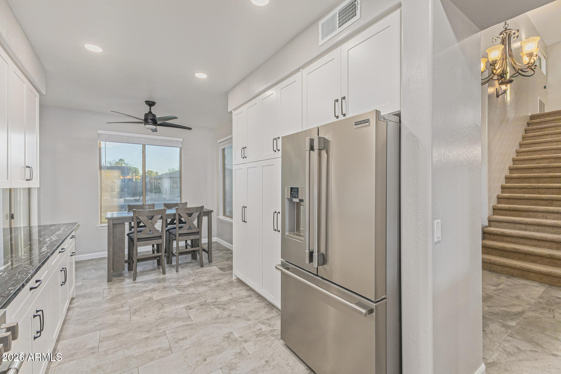 2500 East Milky Way Gilbert, AZ 85295 - Photo 11 of 33 a kitchen with stainless steel appliances granite countertop a refrigerator and a sink