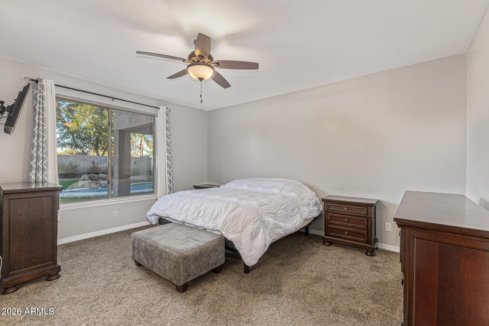 2500 East Milky Way Gilbert, AZ 85295 - Photo 14 of 33 a spacious bedroom with a bed and a window