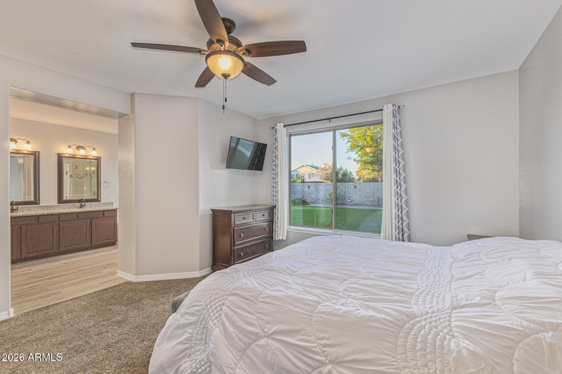 2500 East Milky Way Gilbert, AZ 85295 - Photo 15 of 33 a bedroom with a bed and a television
