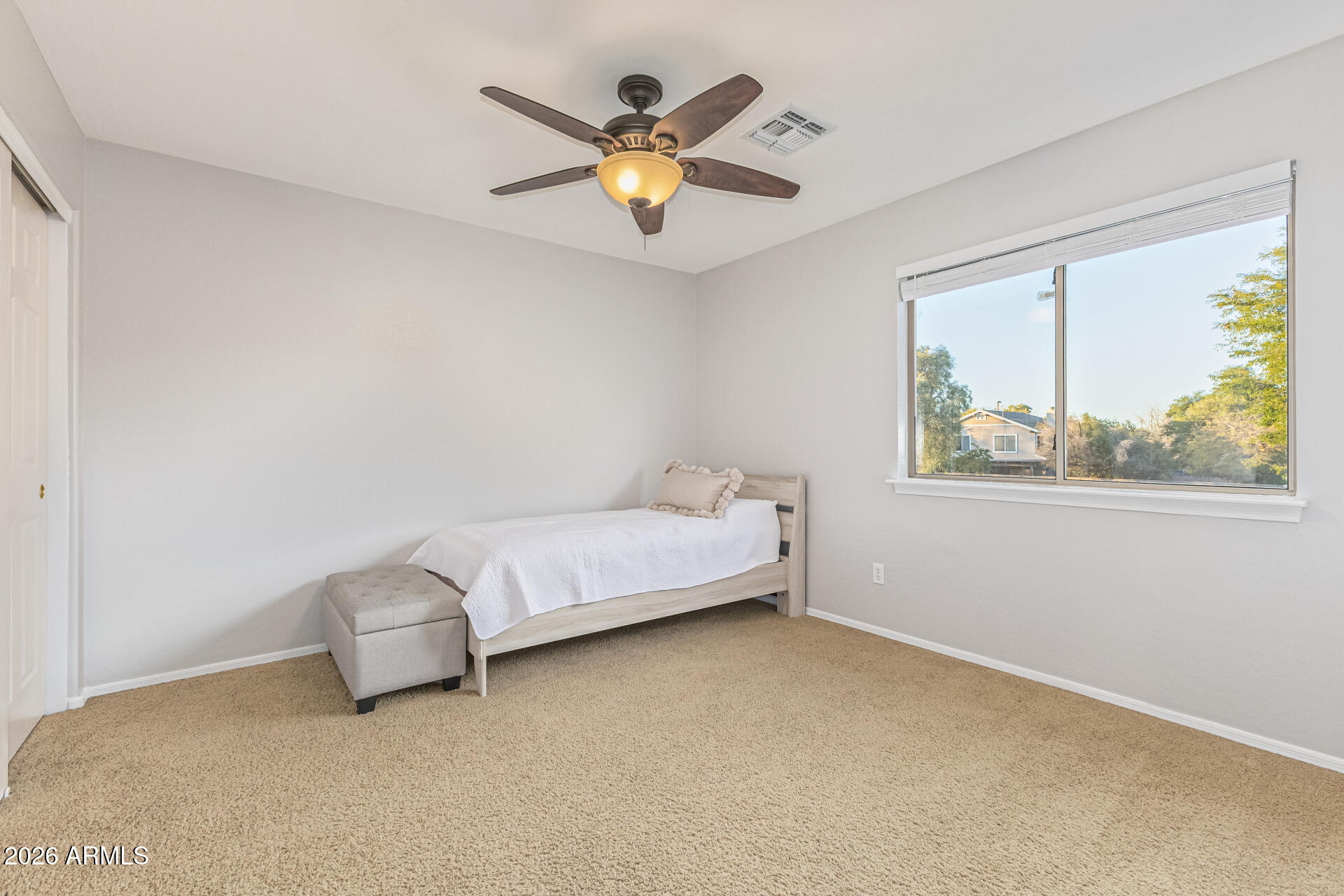 2500 East Milky Way Gilbert, AZ 85295 - Photo 21 of 33 a spacious bedroom with a bed and window