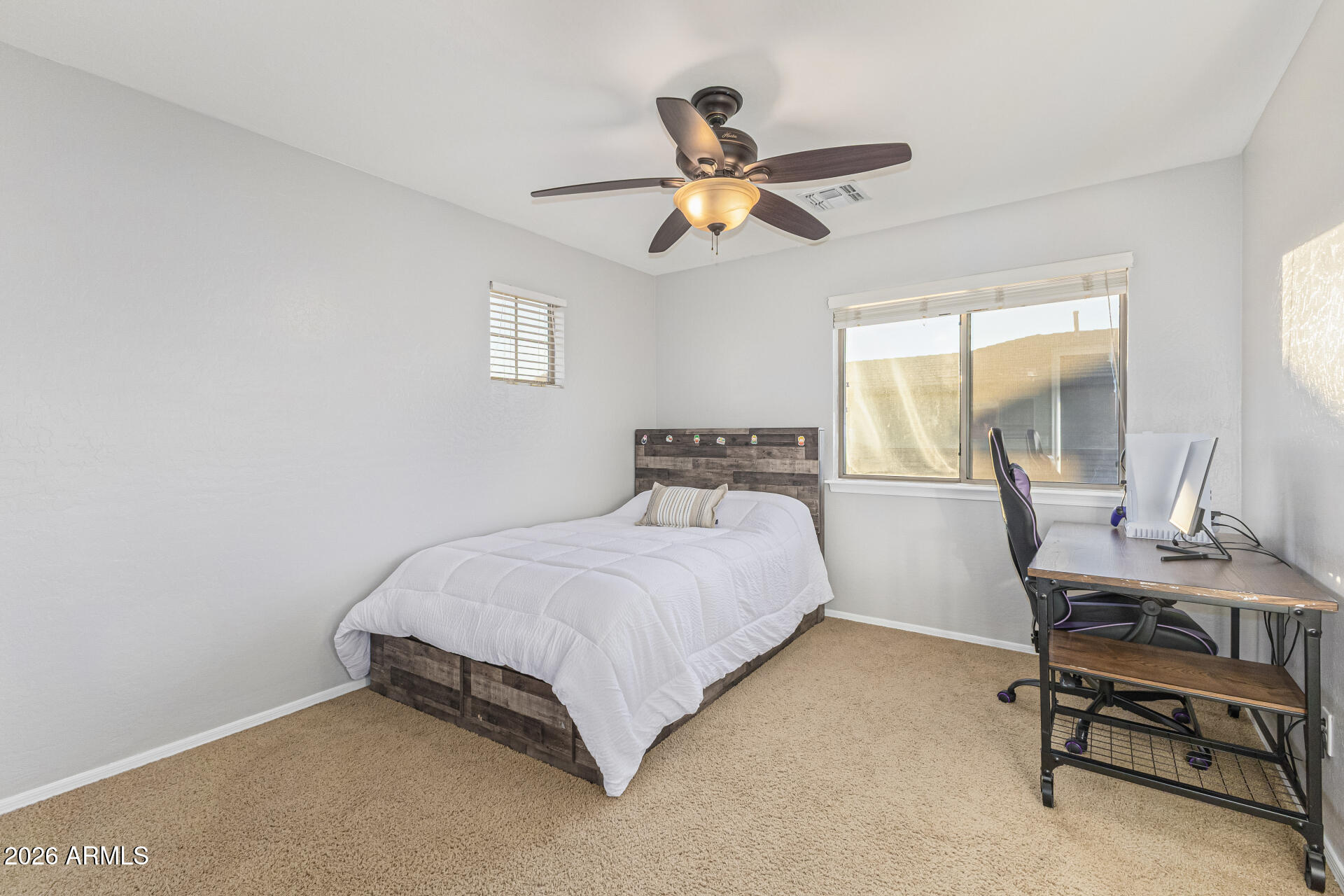 2500 East Milky Way Gilbert, AZ 85295 - Photo 22 of 33 a bedroom with a bed a desk and chair with window