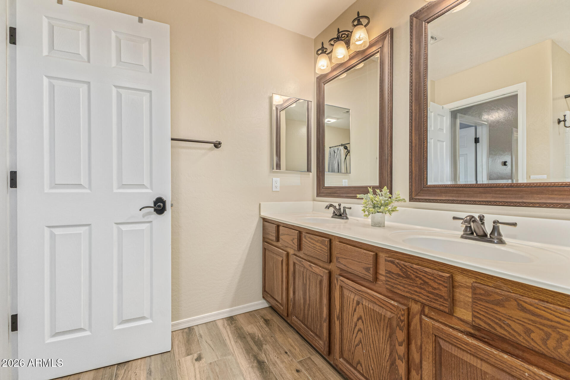 2500 East Milky Way Gilbert, AZ 85295 - Photo 23 of 33 a bathroom with a double vanity sink and a mirror