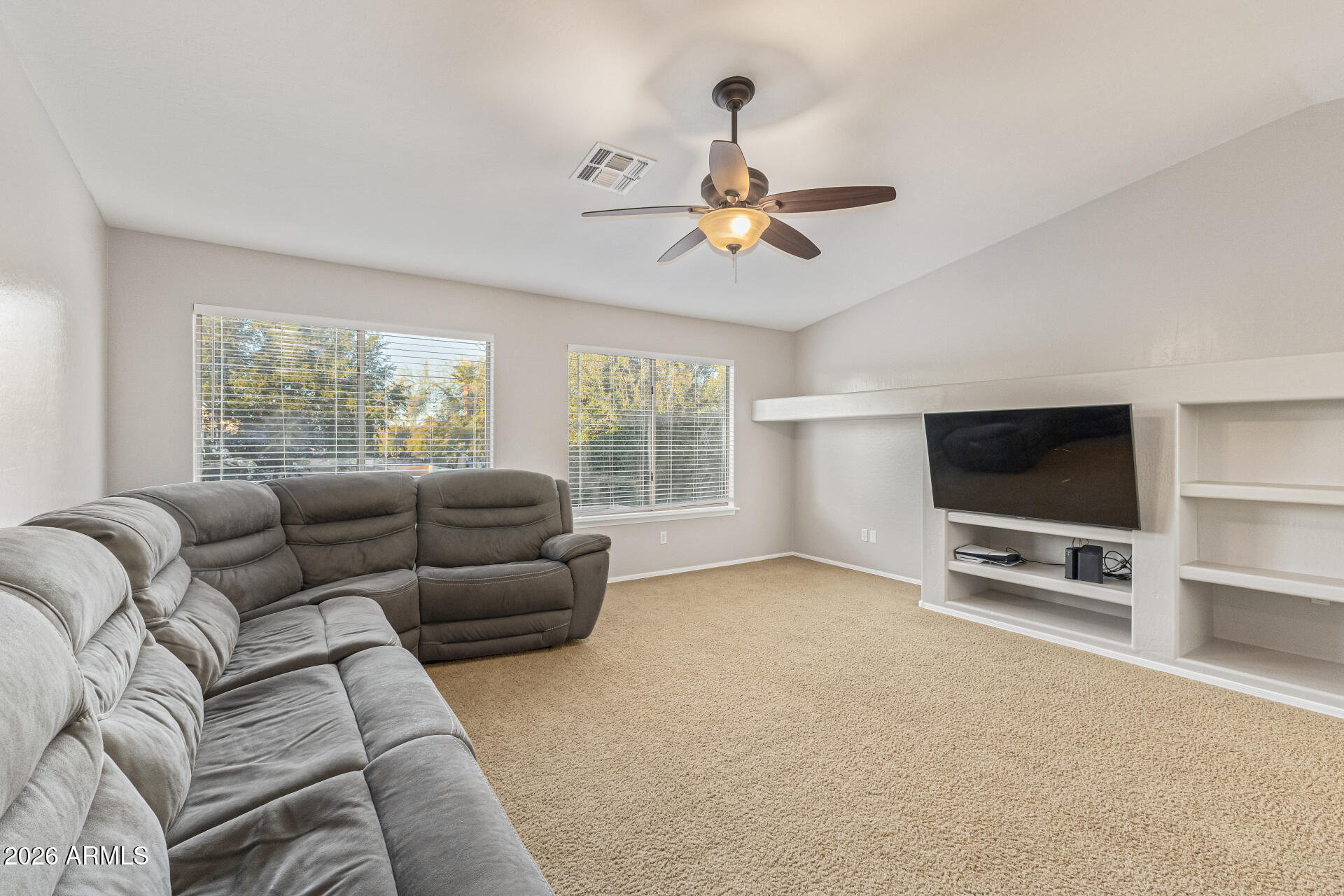 2500 East Milky Way Gilbert, AZ 85295 - Photo 24 of 33 a living room with furniture and a flat screen tv