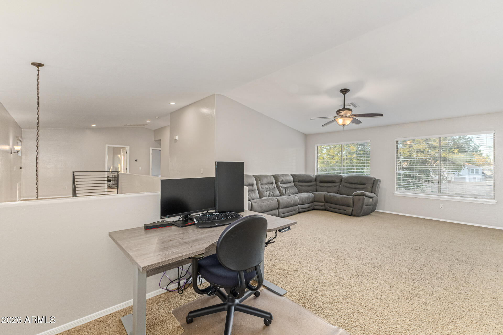 2500 East Milky Way Gilbert, AZ 85295 - Photo 25 of 33 a view of a workspace with furniture and a chandelier