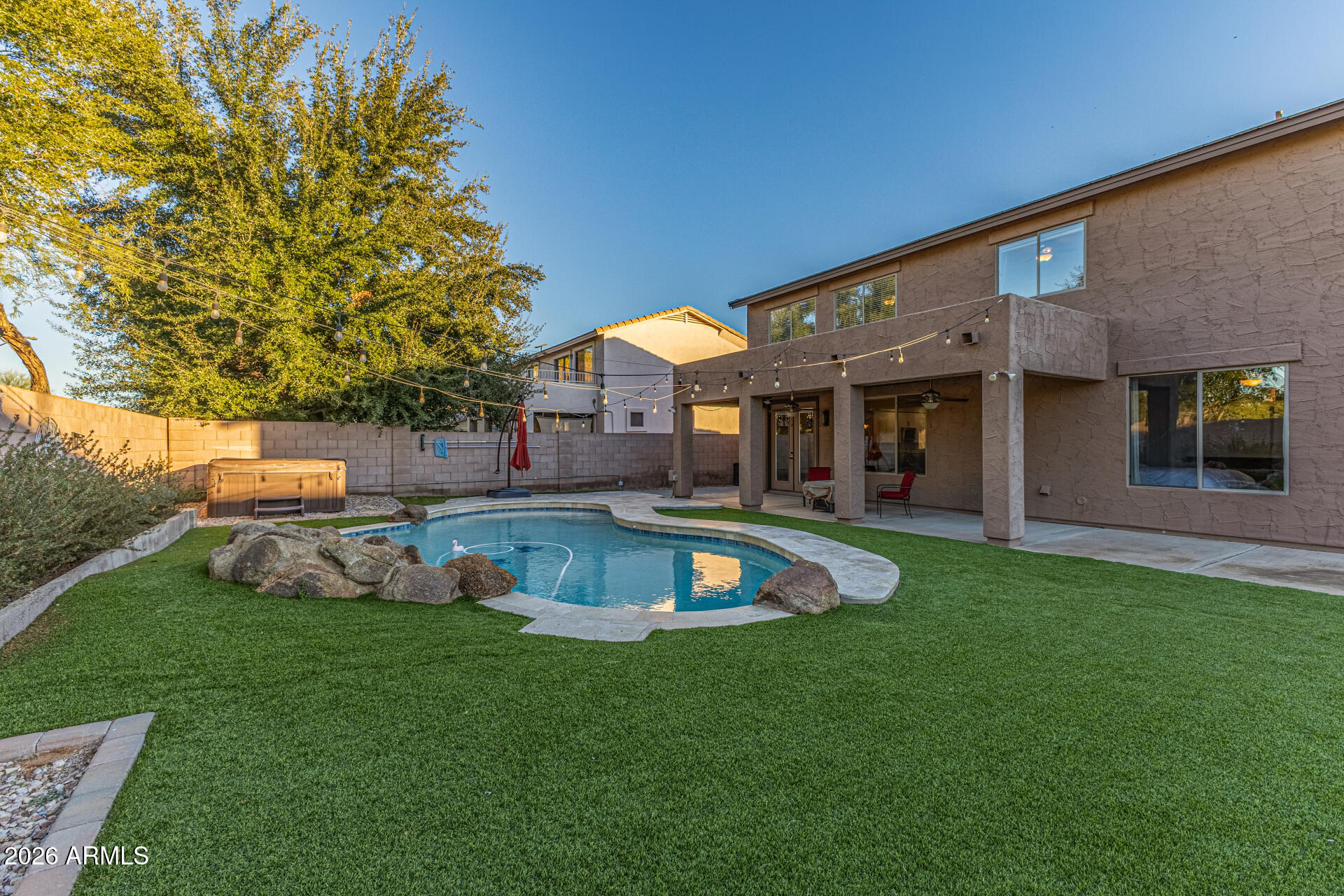 2500 East Milky Way Gilbert, AZ 85295 - Photo 28 of 33 a view of a house with a backyard porch and sitting area