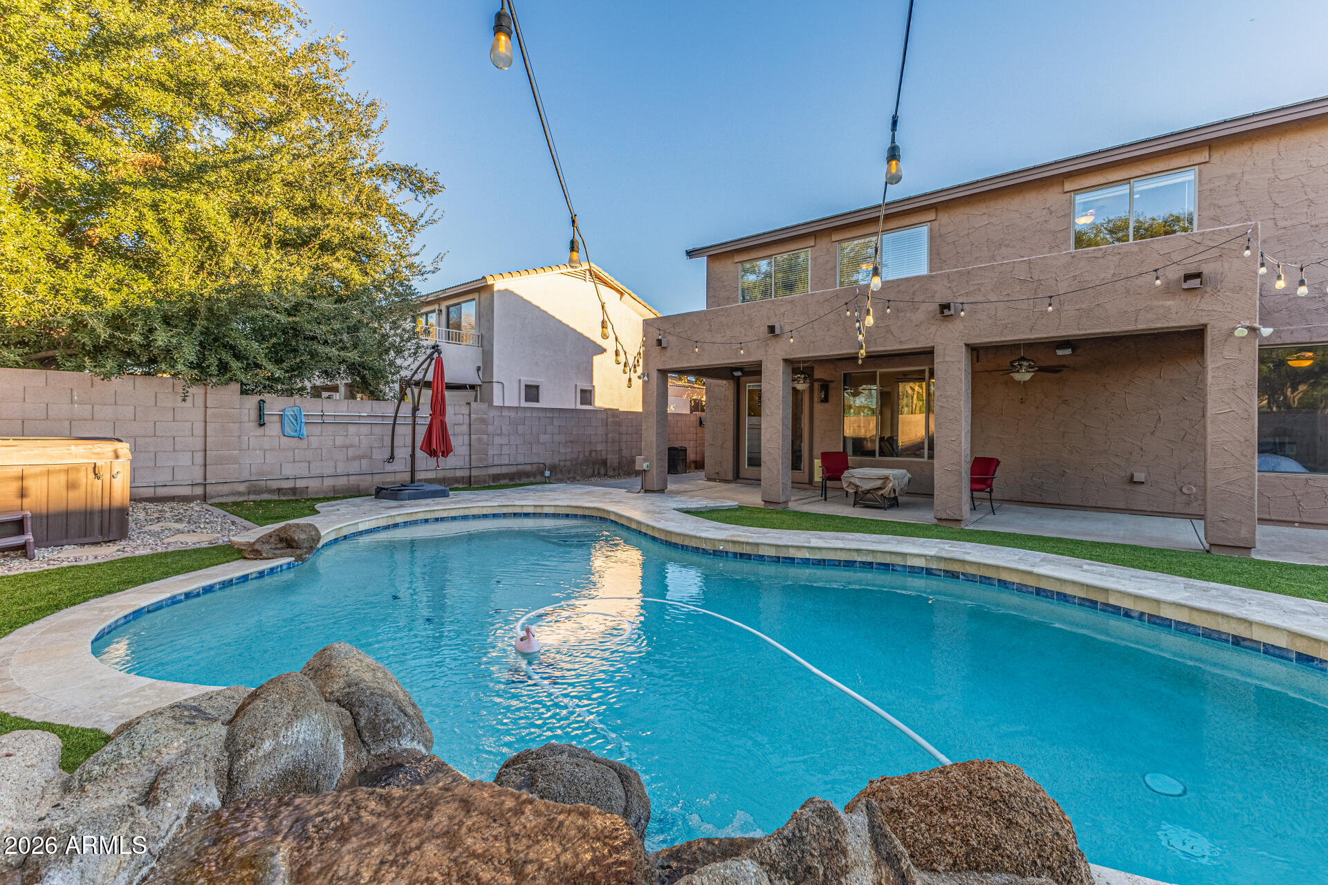 2500 East Milky Way Gilbert, AZ 85295 - Photo 29 of 33 a view of a swimming pool with a patio