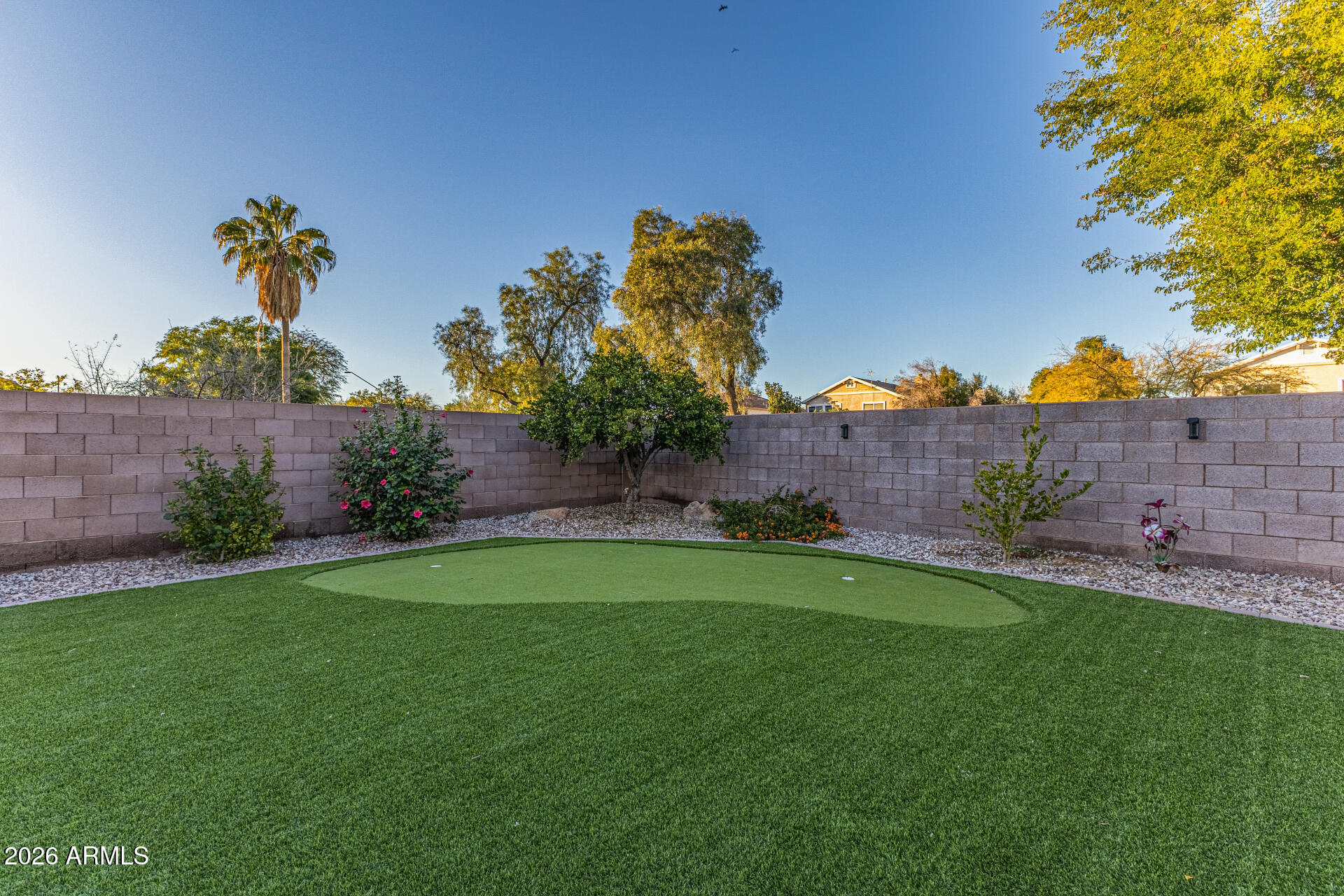 2500 East Milky Way Gilbert, AZ 85295 - Photo 32 of 33 a view of a garden with a house