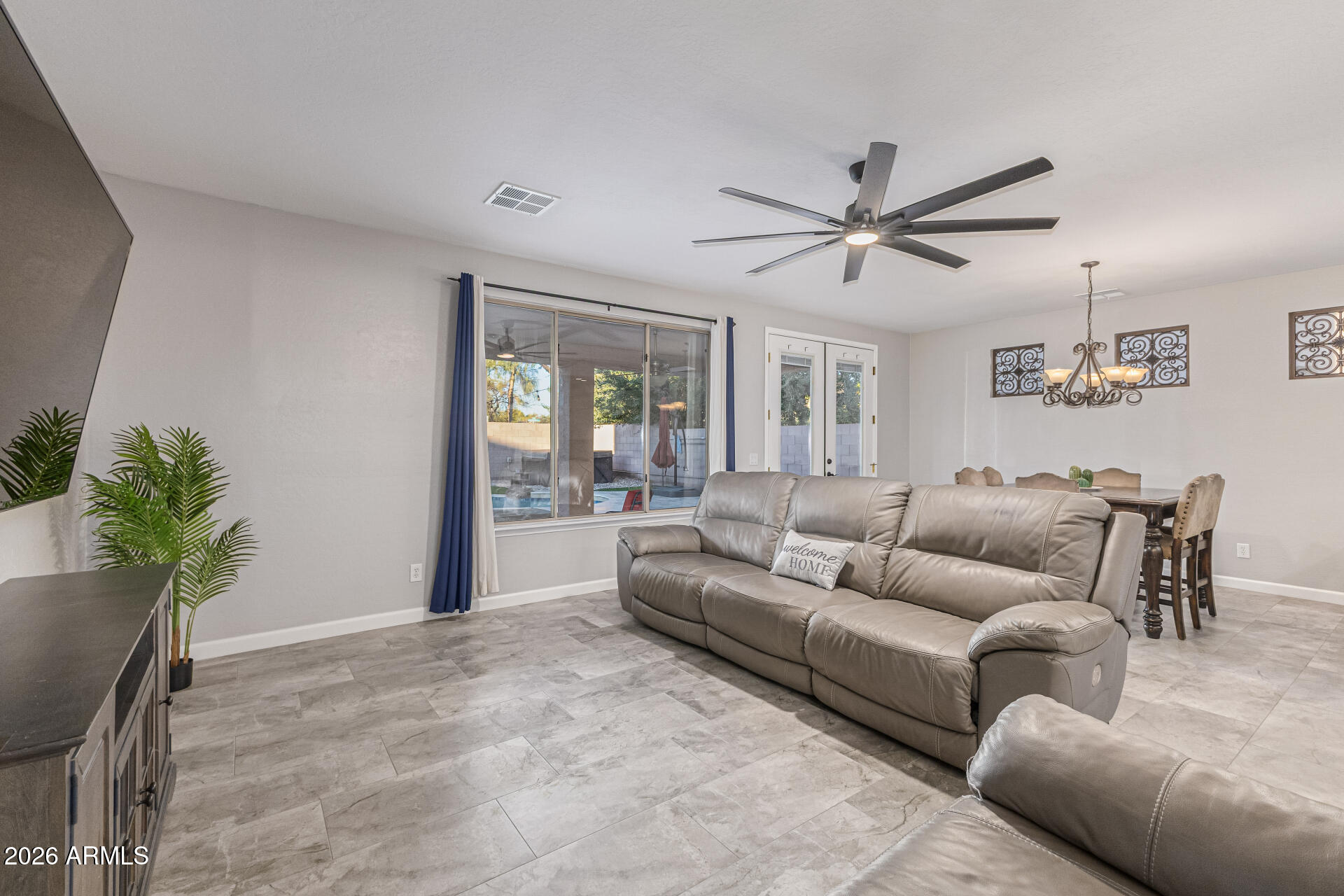 2500 East Milky Way Gilbert, AZ 85295 - Photo 4 of 33 a living room with furniture and a potted plant