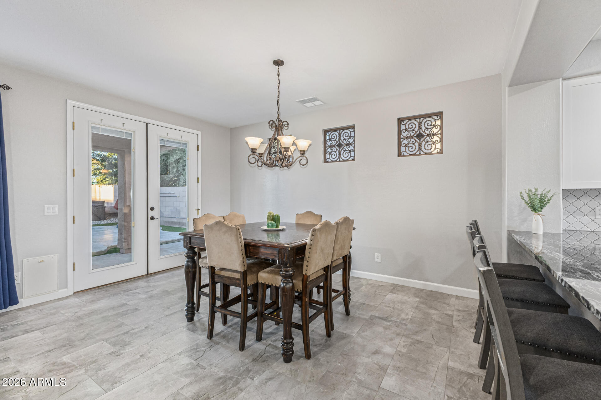 2500 East Milky Way Gilbert, AZ 85295 - Photo 6 of 33 a view of a dining room with furniture and chandelier