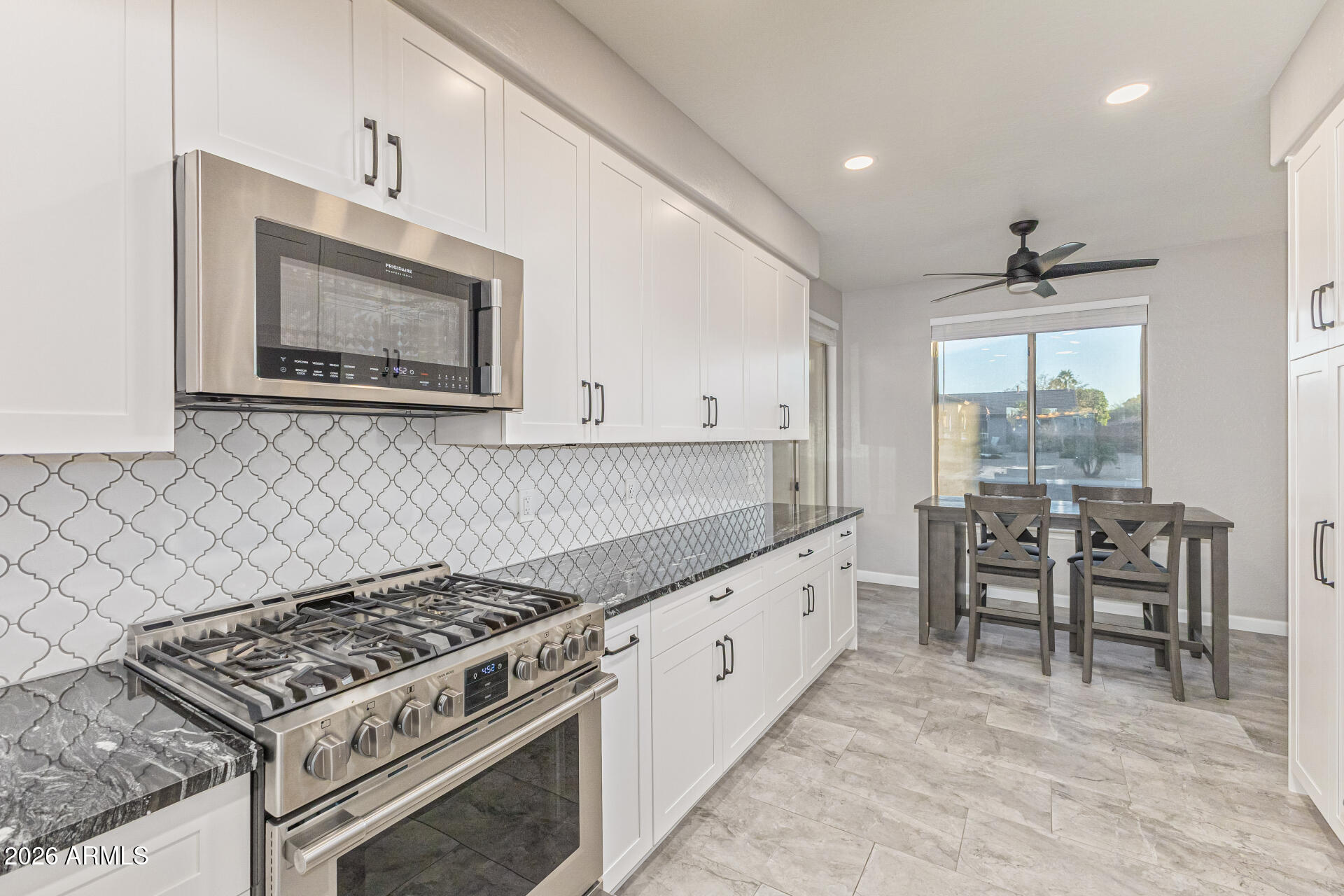 2500 East Milky Way Gilbert, AZ 85295 - Photo 10 of 33 a kitchen with appliances cabinets and furniture