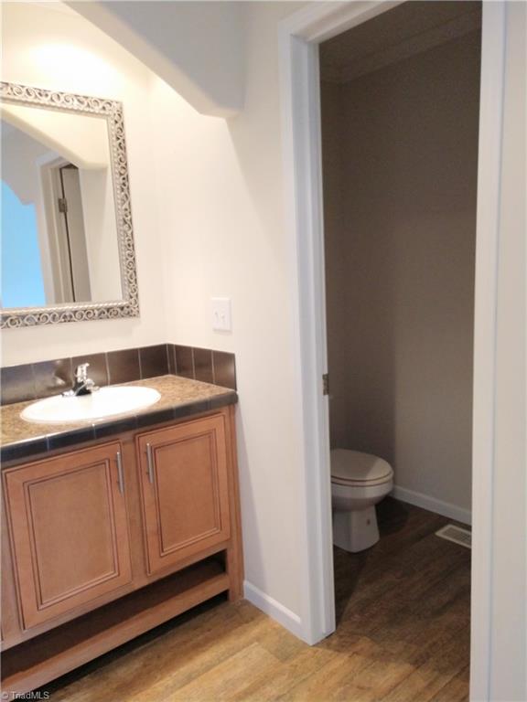 396 Valley Field Road Stoneville, NC 27048 - Photo 12 of 22 "Toilet Room" beside the his and her sinks in the master bath