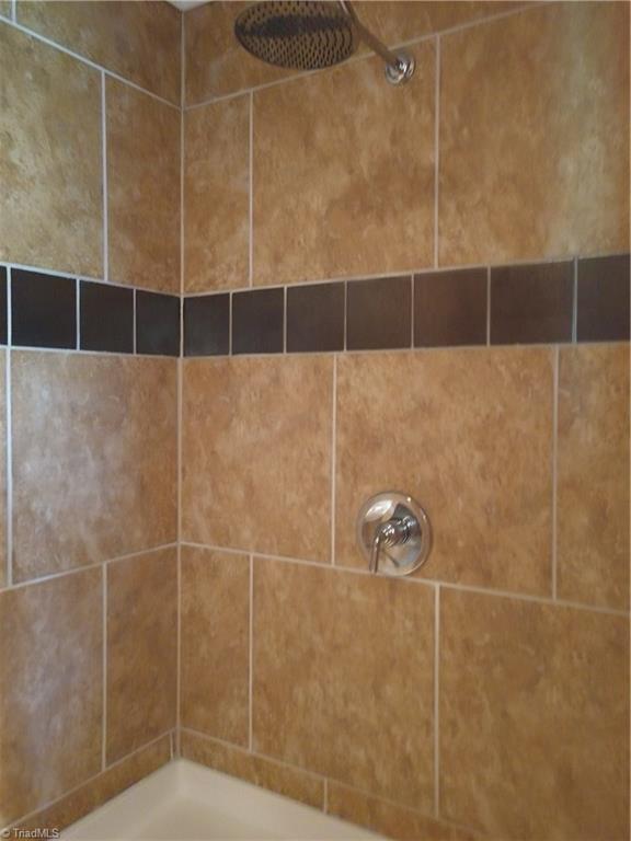 396 Valley Field Road Stoneville, NC 27048 - Photo 16 of 22 Double shower with each side having their own shower head and controls