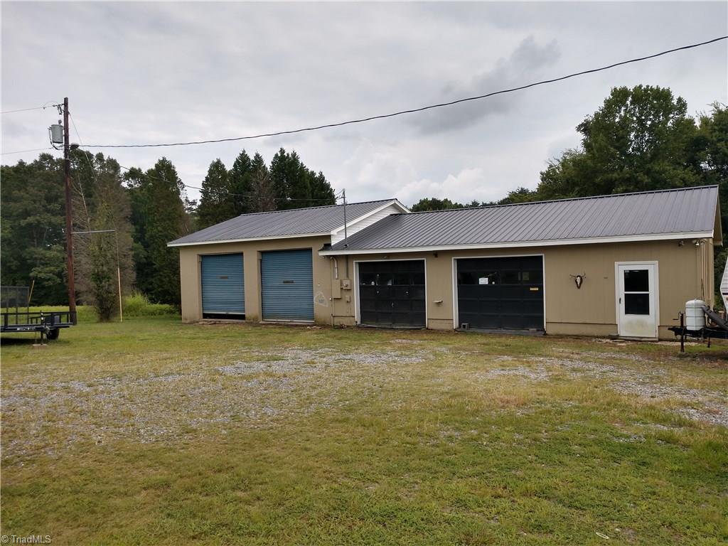 396 Valley Field Road Stoneville, NC 27048 - Photo 3 of 22 Man Cave 4 car garage with studio apartment....recent updated metal roof
