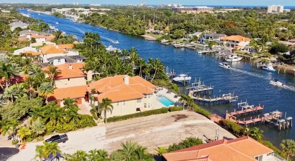 an aerial view of a house with a lake view