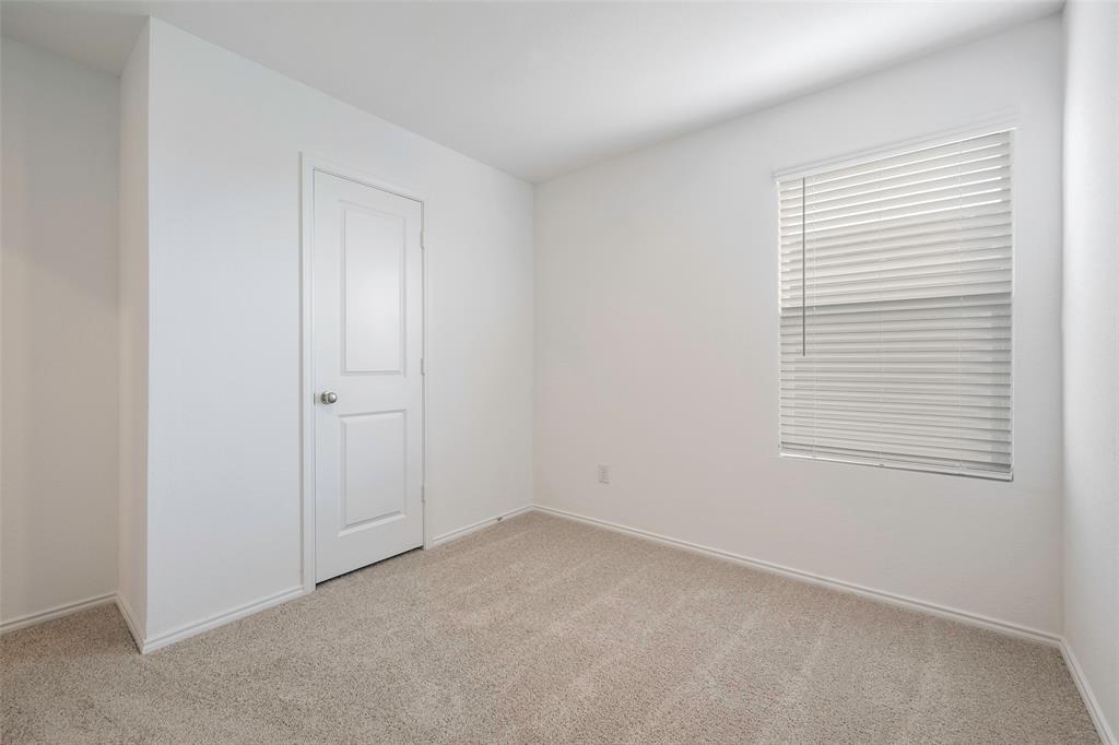 209 Boxberry Way Princeton, TX 75407 - Photo 13 of 34 an empty room with a window