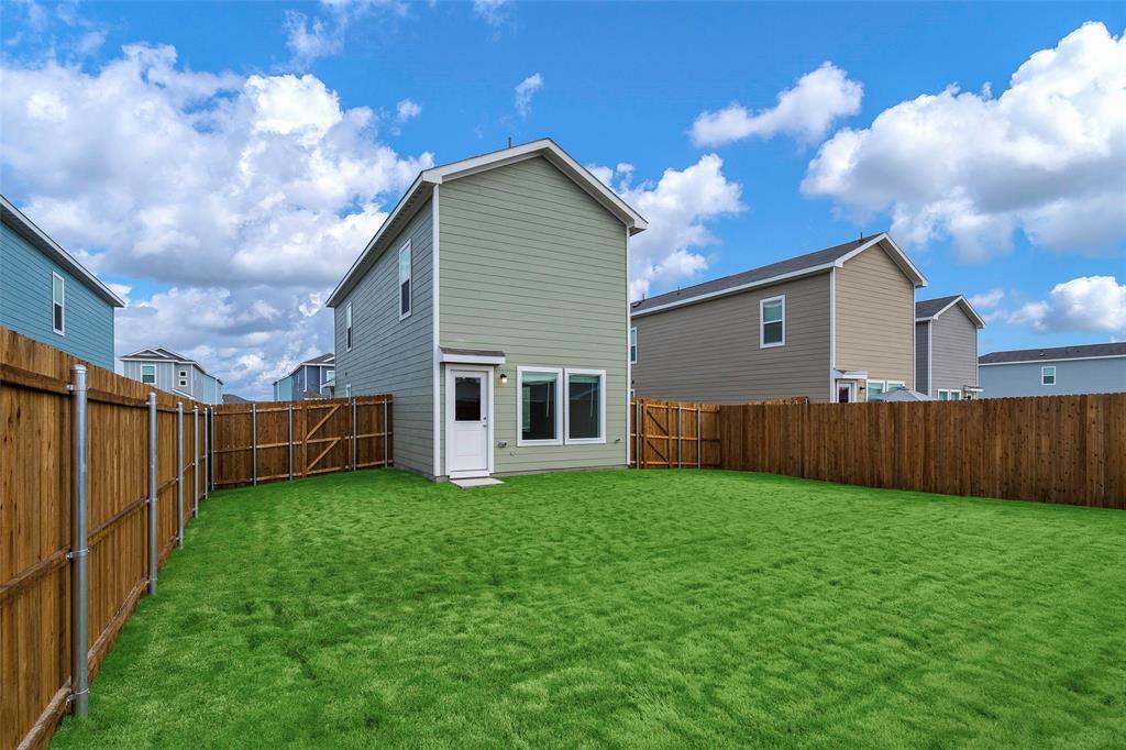 209 Boxberry Way Princeton, TX 75407 - Photo 18 of 34 a view of a backyard of the house