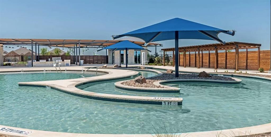 209 Boxberry Way Princeton, TX 75407 - Photo 32 of 34 a swimming pool with outdoor seating and yard