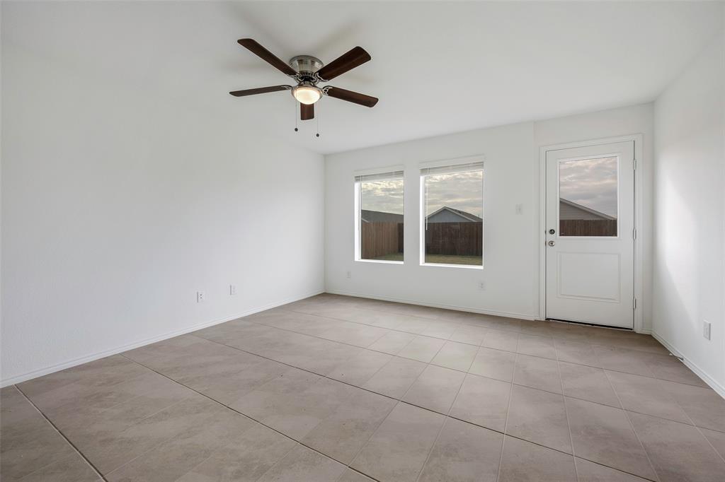 209 Boxberry Way Princeton, TX 75407 - Photo 8 of 34 a view of a livingroom with a ceiling fan and window