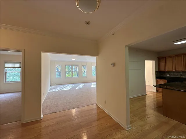 a view of livingroom with hardwood floor and a ceiling fan