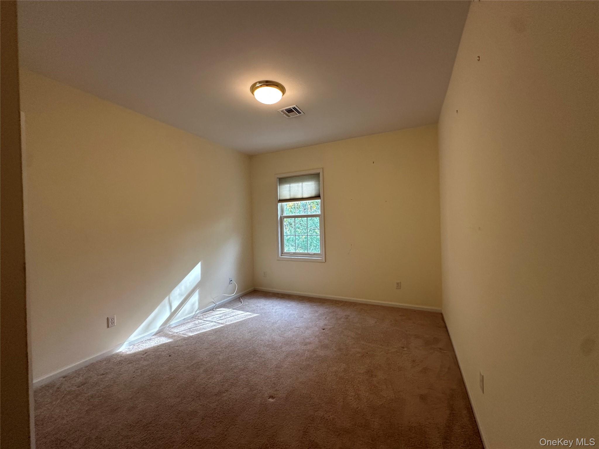 75 Quaker Avenue, Unit 315 Cornwall, NY 12518 - Photo 24 of 48 an empty room with windows