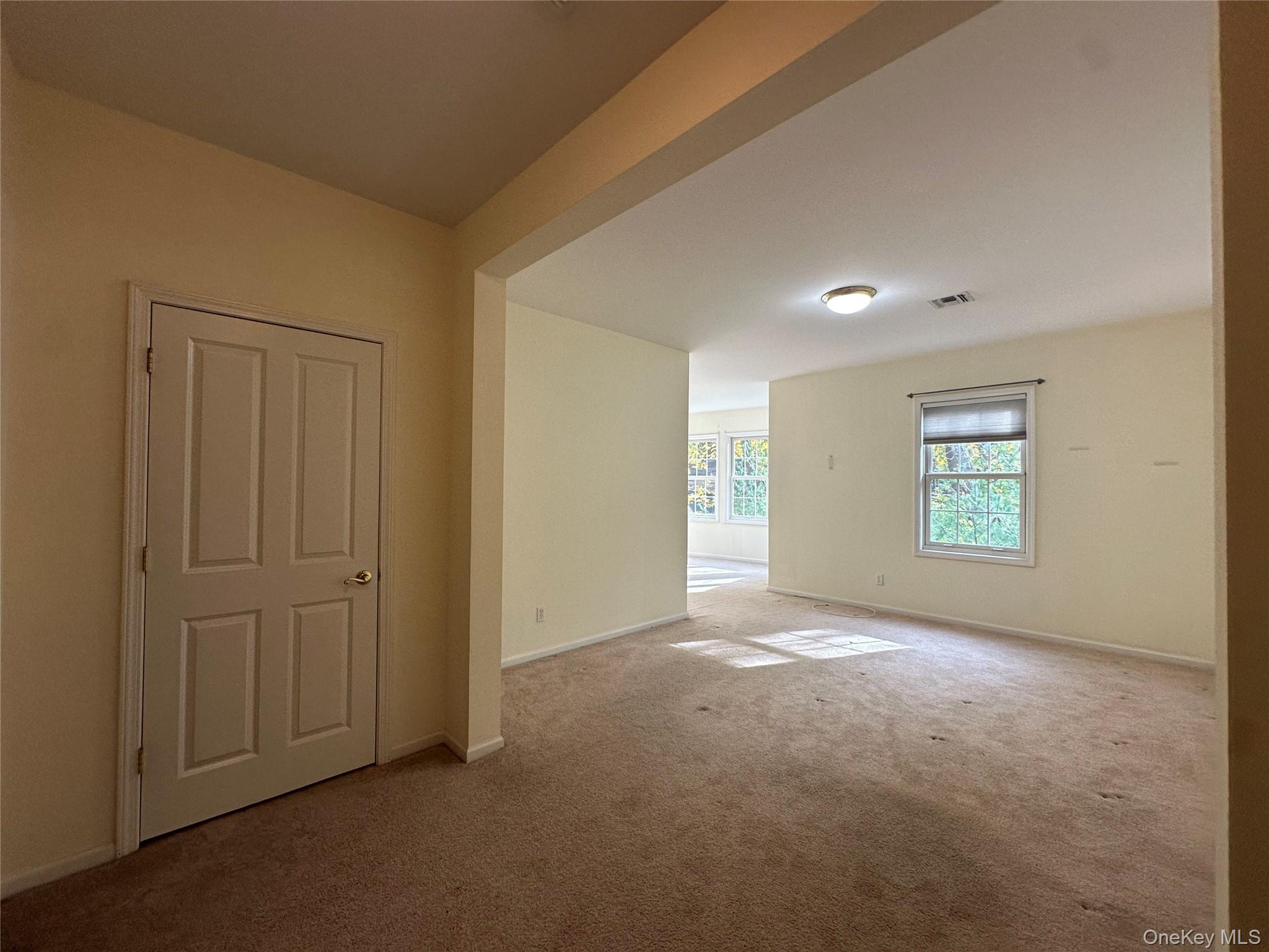 75 Quaker Avenue, Unit 315 Cornwall, NY 12518 - Photo 28 of 48 an empty room with windows