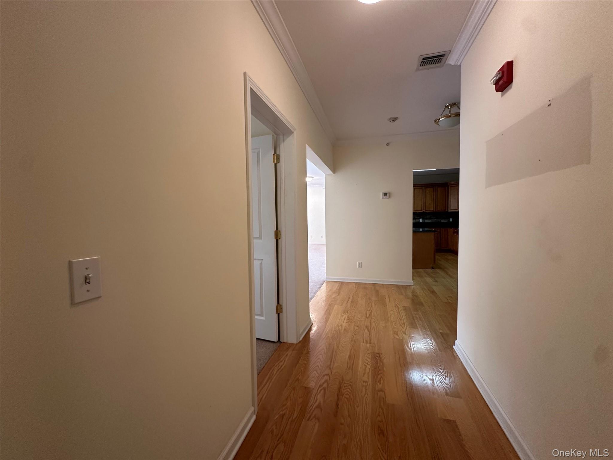 75 Quaker Avenue, Unit 315 Cornwall, NY 12518 - Photo 35 of 48 a view of a hallway with wooden floor