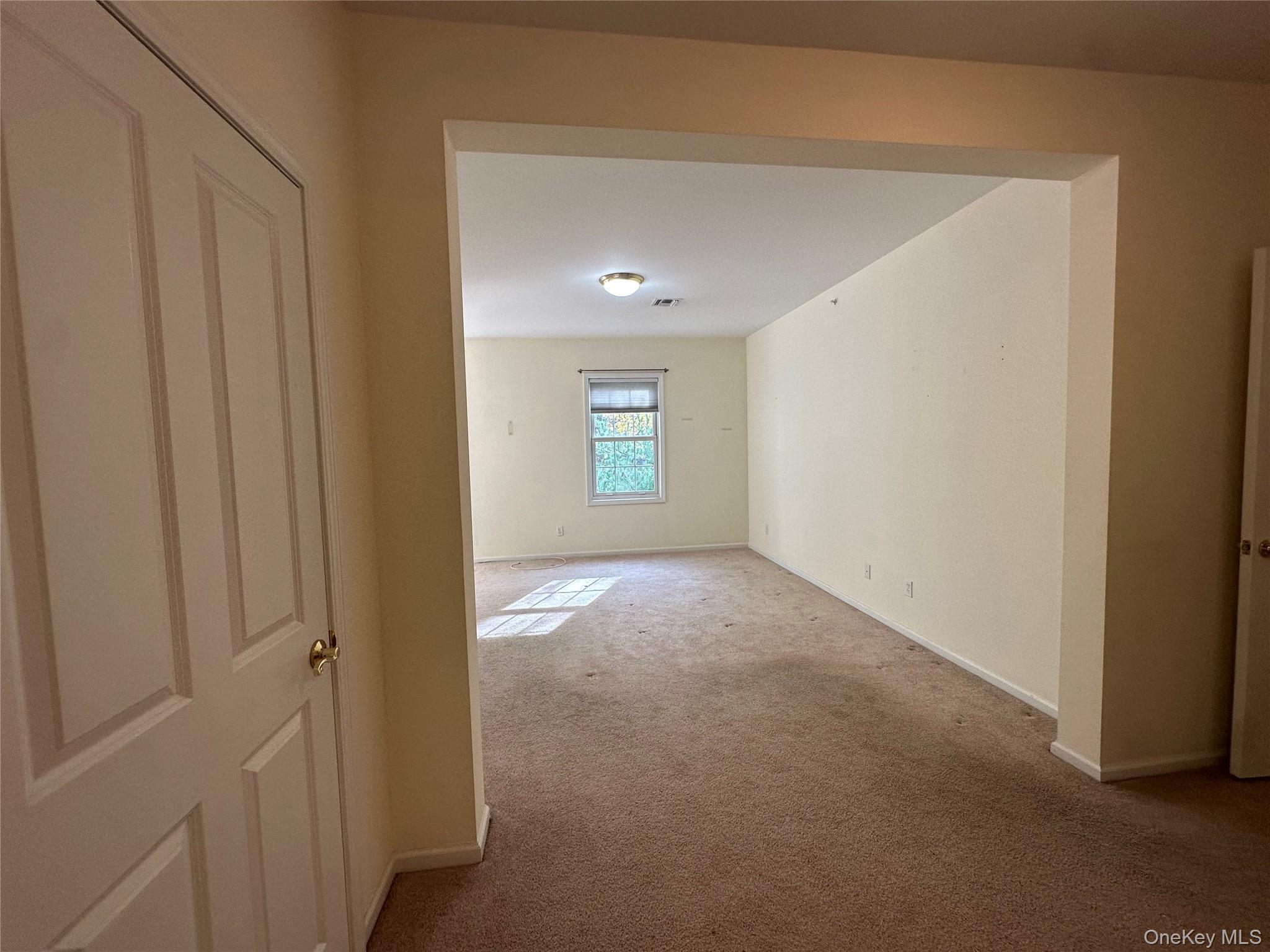 75 Quaker Avenue, Unit 315 Cornwall, NY 12518 - Photo 36 of 48 a view of an empty room and window
