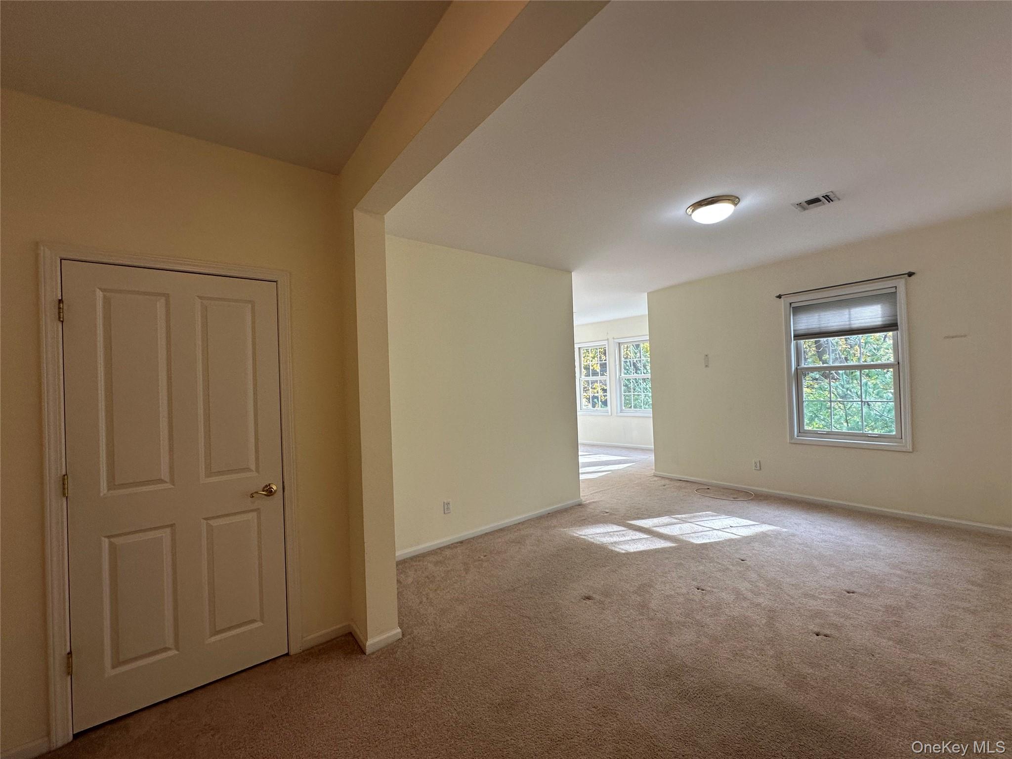 75 Quaker Avenue, Unit 315 Cornwall, NY 12518 - Photo 37 of 48 an empty room with windows