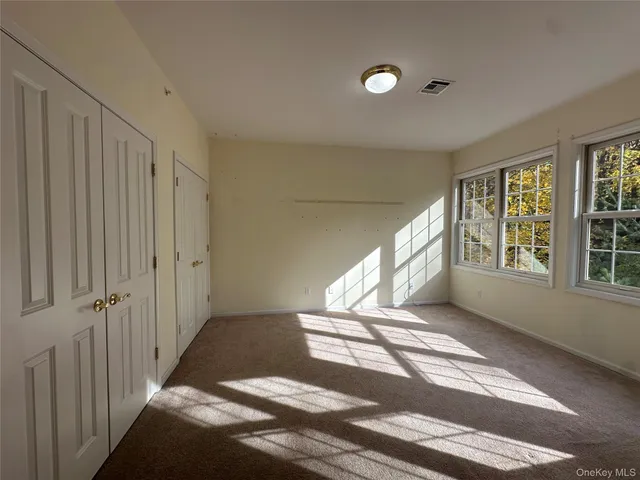 a view of entryway with stairs and a window