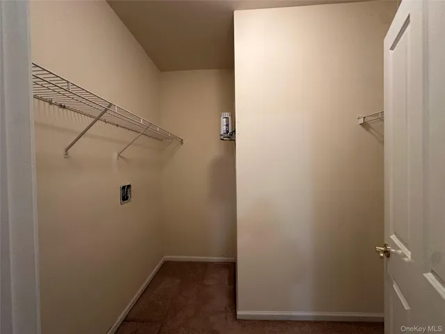 a bathroom with a granite countertop sink a mirror and a shower