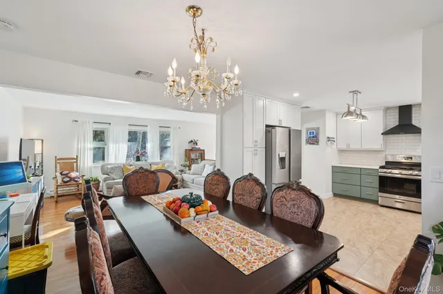 a kitchen with stainless steel appliances granite countertop a refrigerator stove and sink