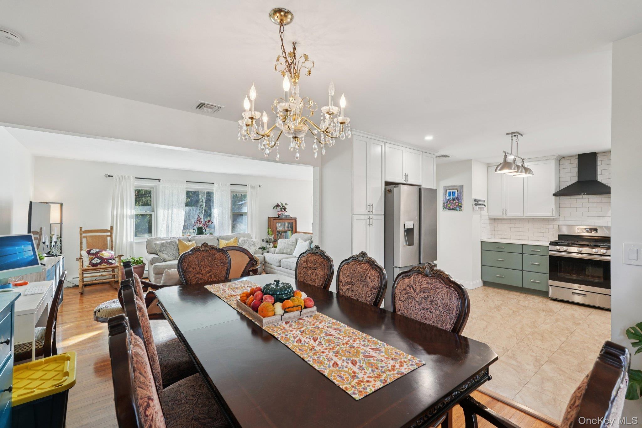 52 Pine Brook Road Monsey, NY 10952 - Photo 13 of 47 a living room with stainless steel appliances furniture a chandelier and a kitchen view