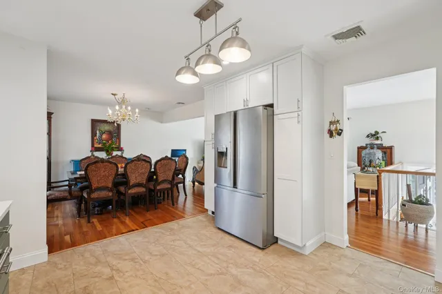 a bedroom with a bed and a wooden floor