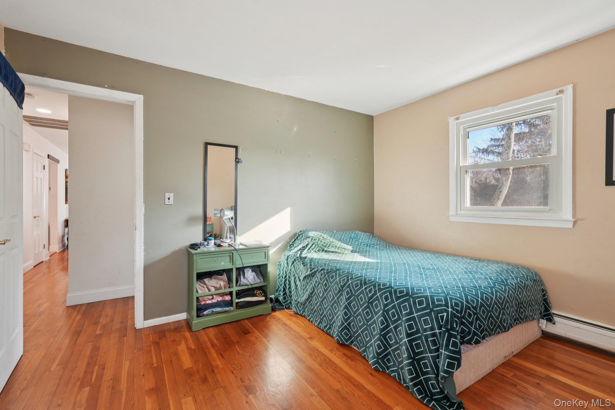 52 Pine Brook Road Monsey, NY 10952 - Photo 20 of 47 a bedroom with a bed table and a window