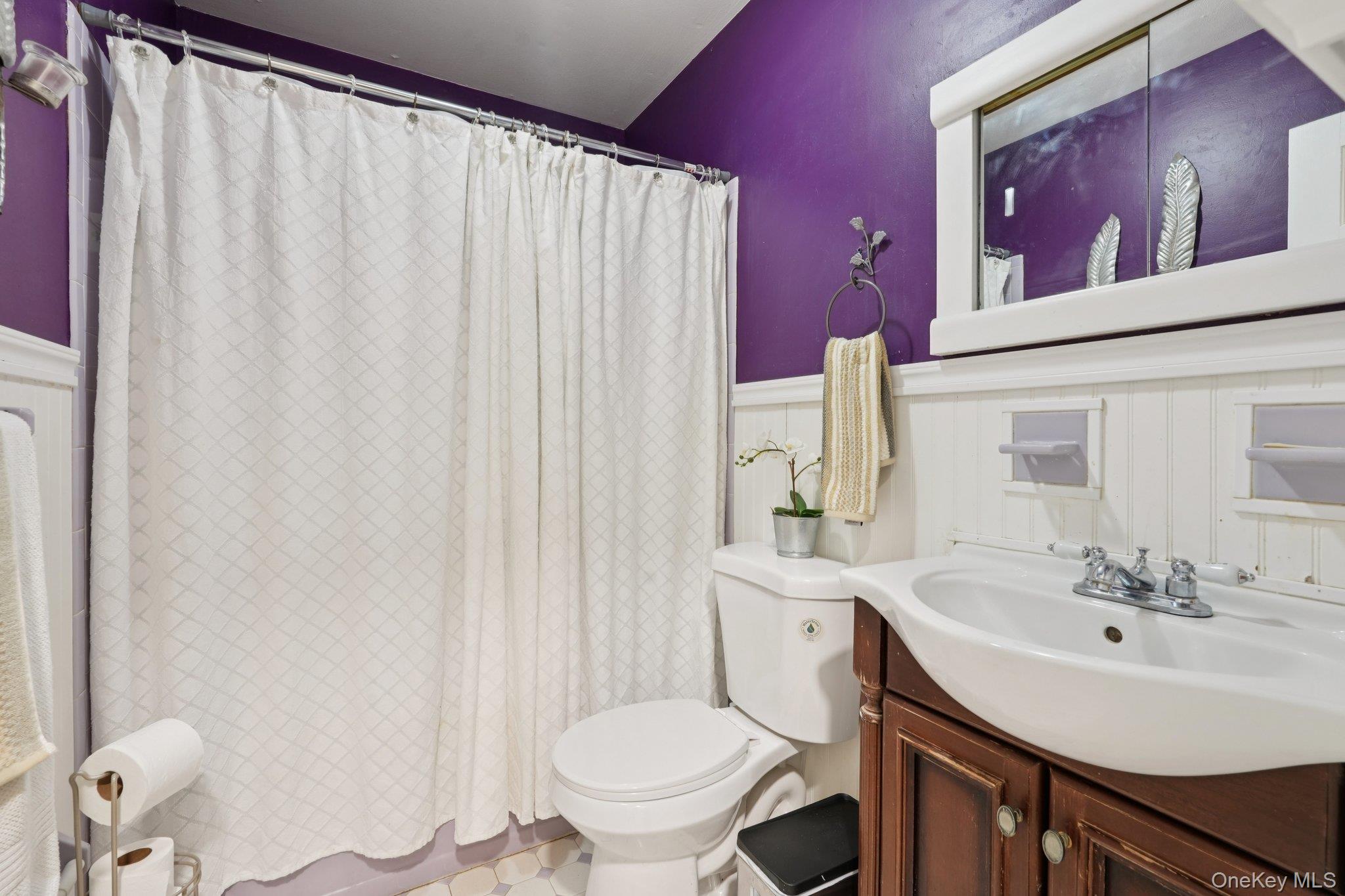 52 Pine Brook Road Monsey, NY 10952 - Photo 22 of 47 a bathroom with a sink vanity mirror and toilet