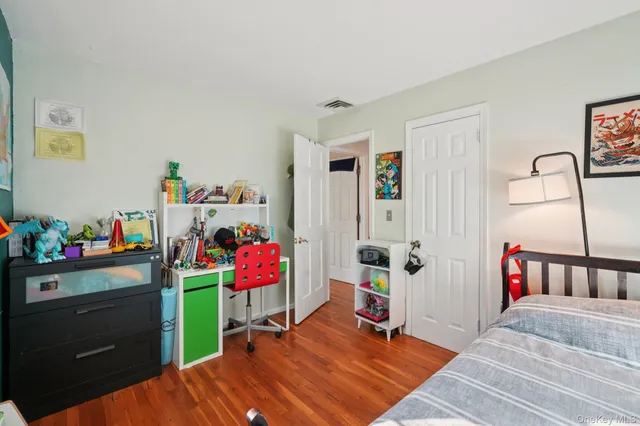 a bedroom with a bed and a closet