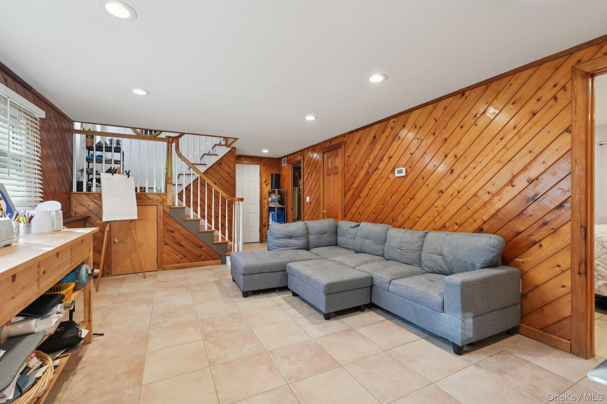 52 Pine Brook Road Monsey, NY 10952 - Photo 28 of 47 a living room with furniture and a flat screen tv