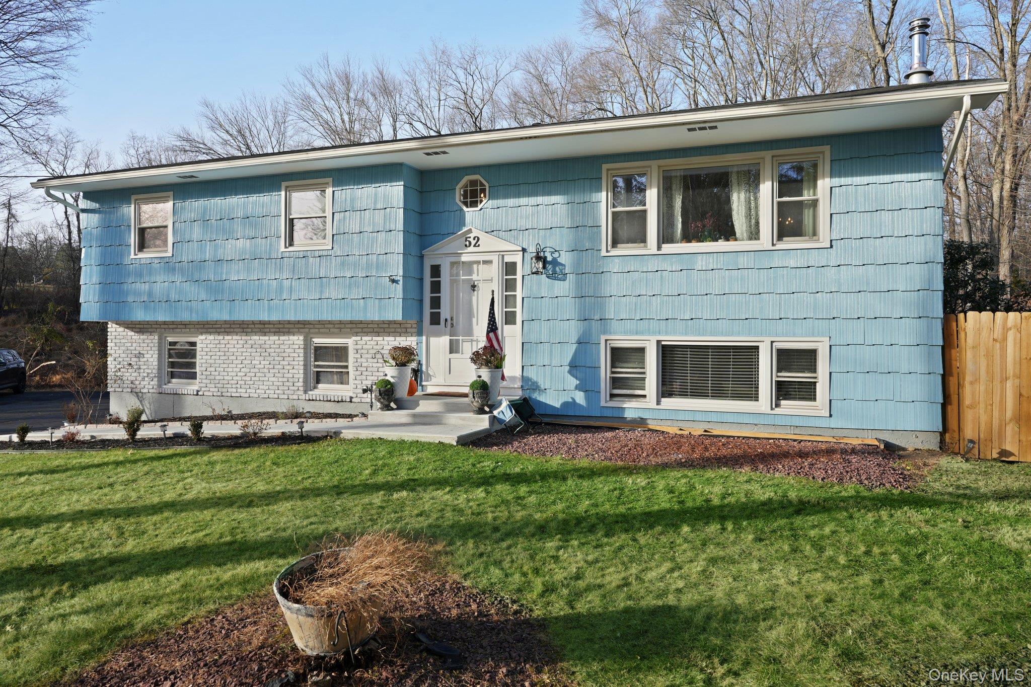 52 Pine Brook Road Monsey, NY 10952 - Photo 3 of 47 a front view of a house with a yard and garage