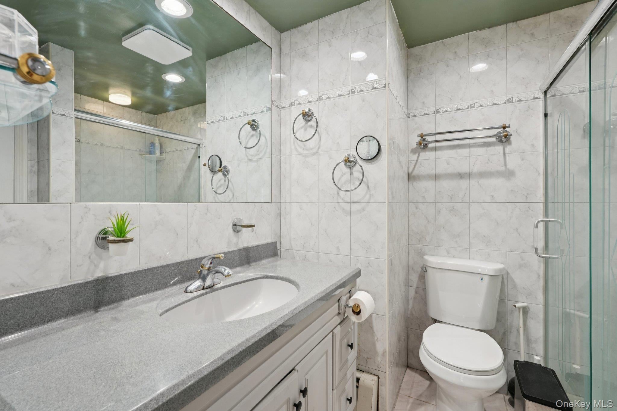 52 Pine Brook Road Monsey, NY 10952 - Photo 33 of 47 a bathroom with a granite countertop sink toilet and shower