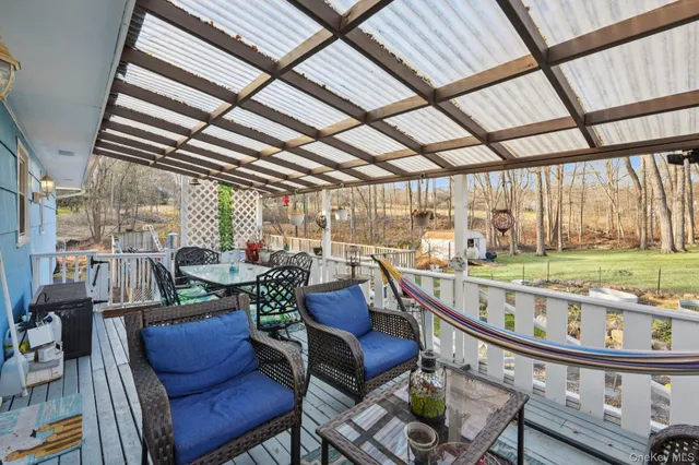 a view of a patio with a table and chairs