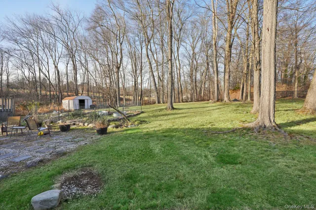 a backyard of a house with lots of green space