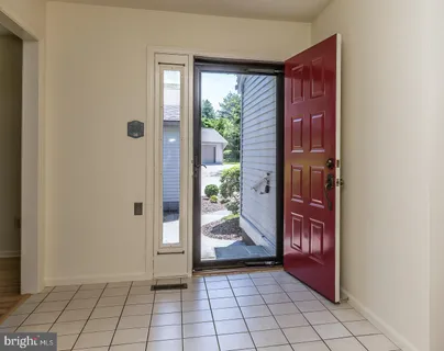 a kitchen with stainless steel appliances granite countertop a stove top oven a sink dishwasher a refrigerator and a microwave oven