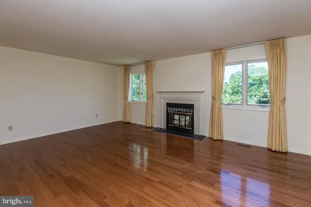 a bathroom with a sink a light fixture and a mirror
