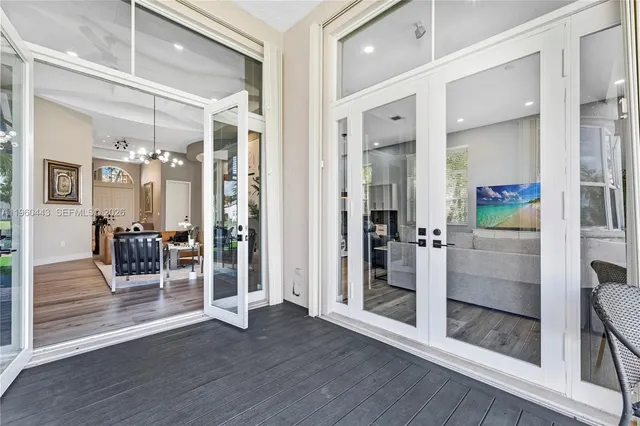 a view of a house with a yard patio and swimming pool