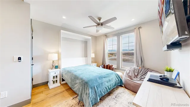 a bedroom with a bed and a couch